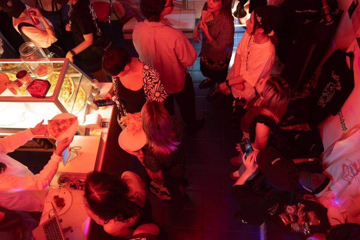 Crowd inside, red glow
