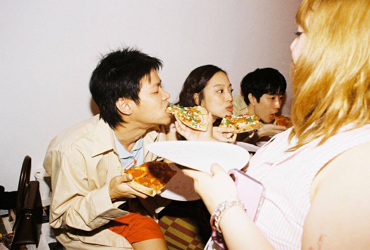 Friends sharing pizza